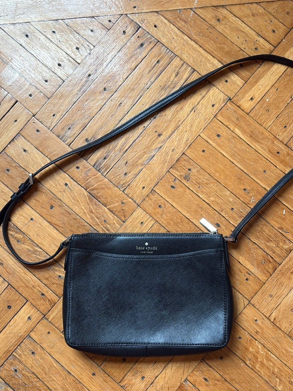 kate spade black leather crossbody clutch with gold-tone zipper